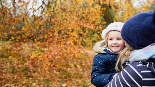 Mother and daughter in the landscaped garden in autumn at Stowe, Buckinghamshire